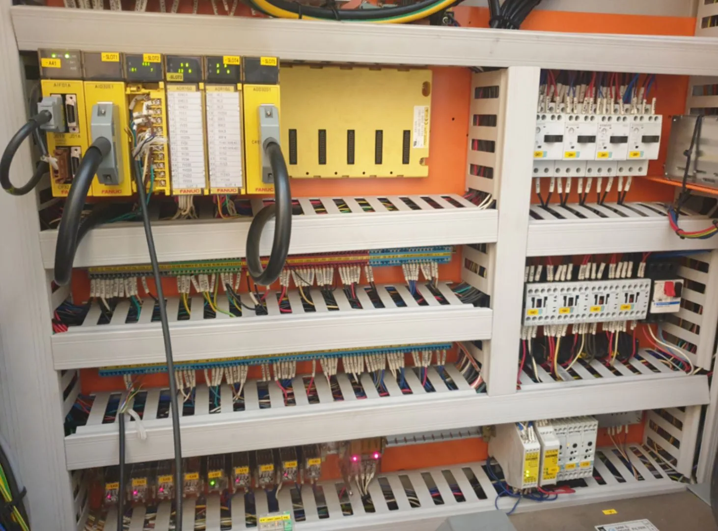 Fanuc CNC control cabinet being diagnosed by a VA Electronic Solutions technician